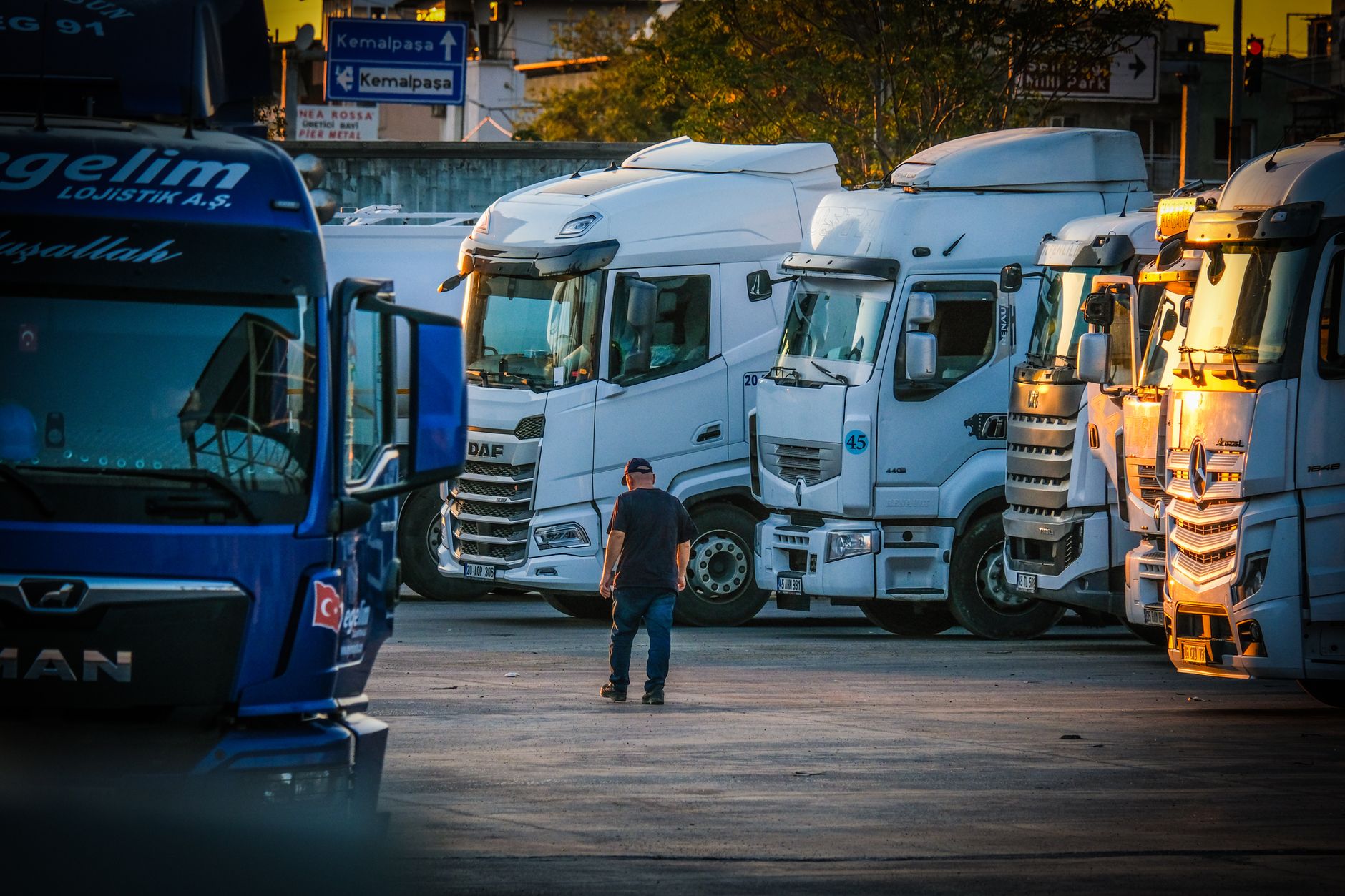 Trucking business owner standing in front of his semi truck