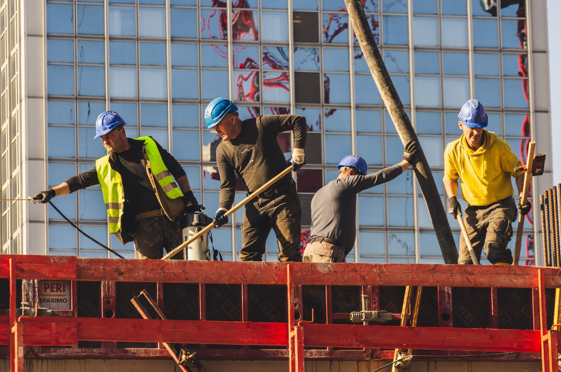 Construction site workers representing cash flow challenges in the construction industry