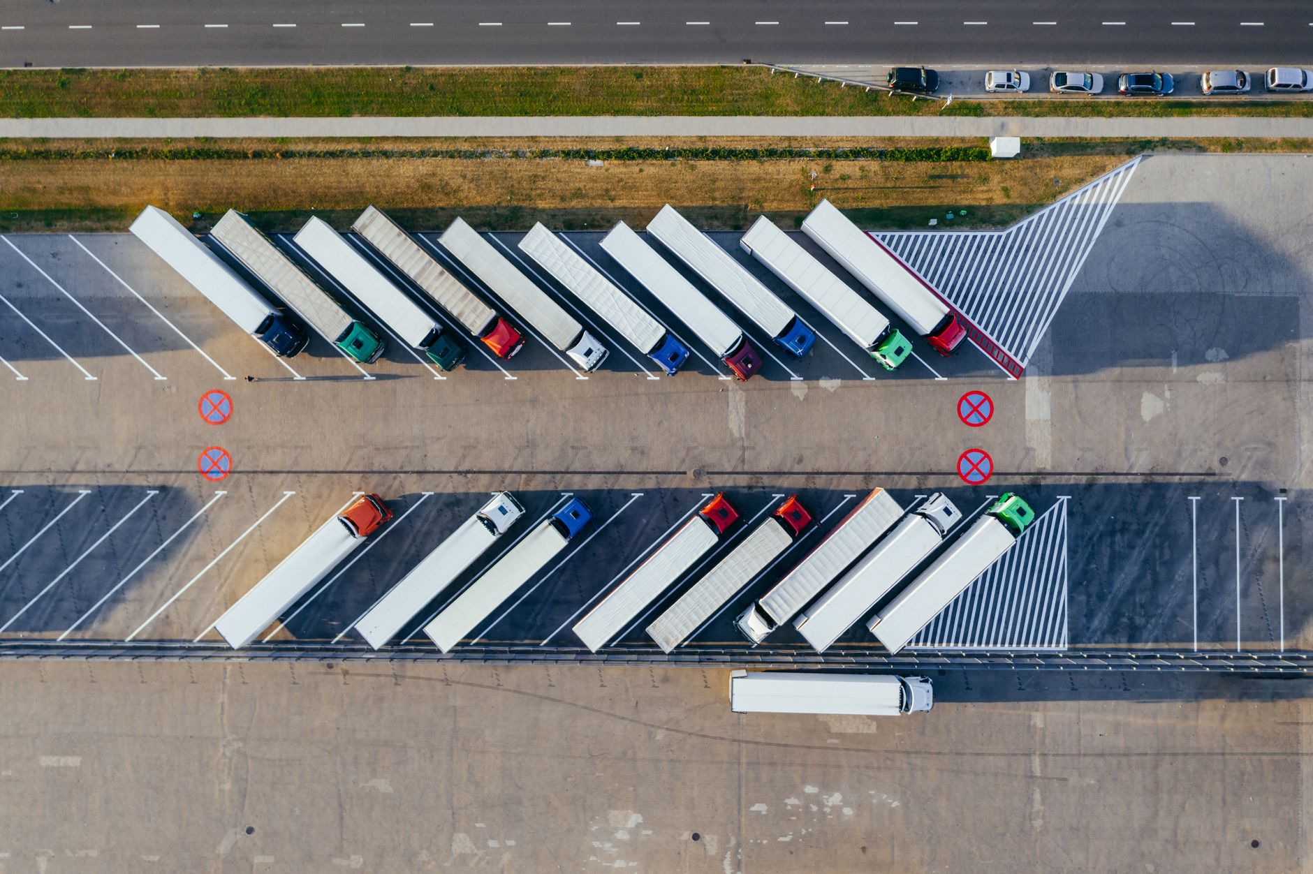 Aerial view of semi trucks parked at a logistics company