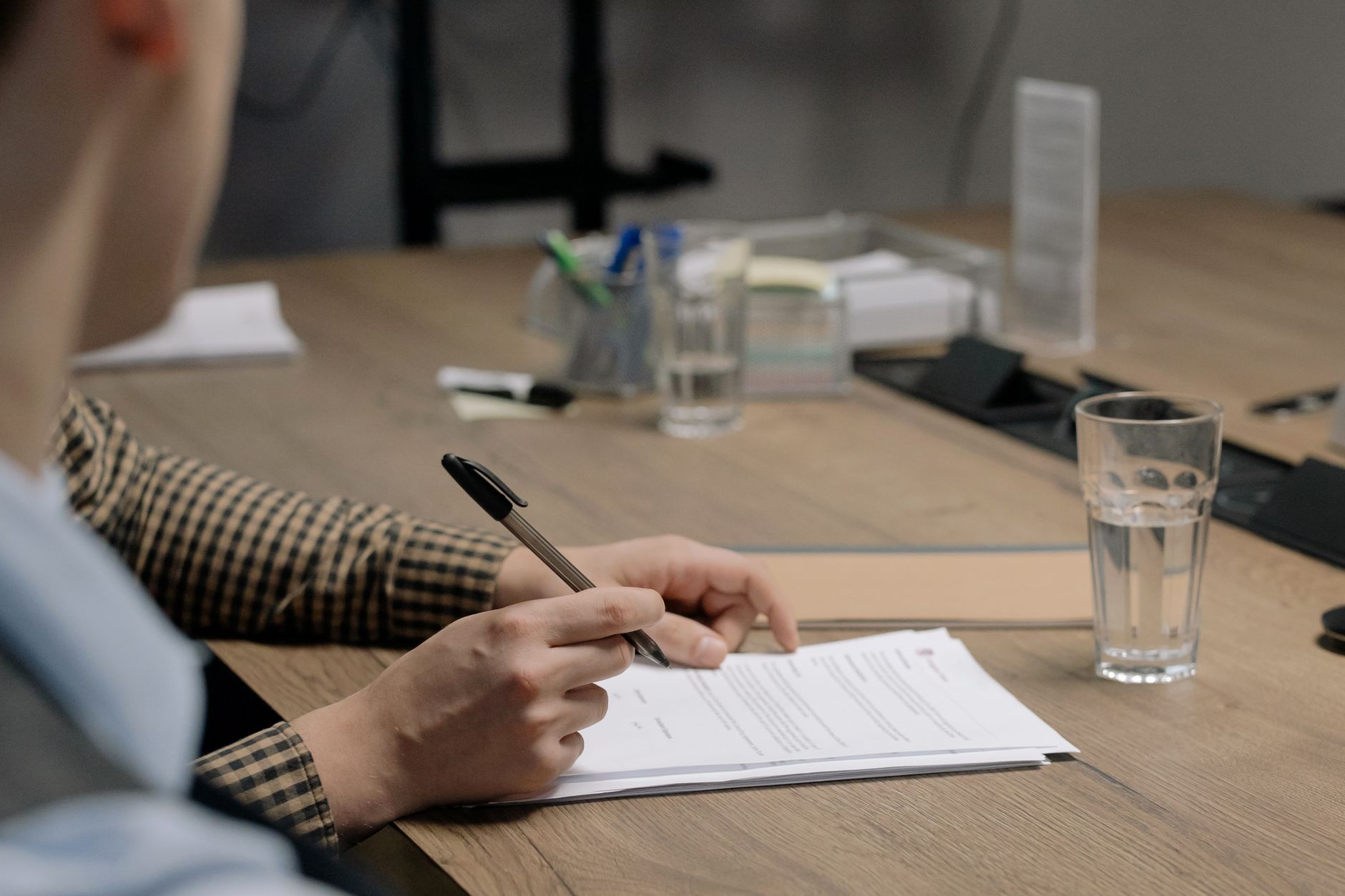Business owner carefully reviewing a funding offer to avoid a bait-and-switch financing tactic