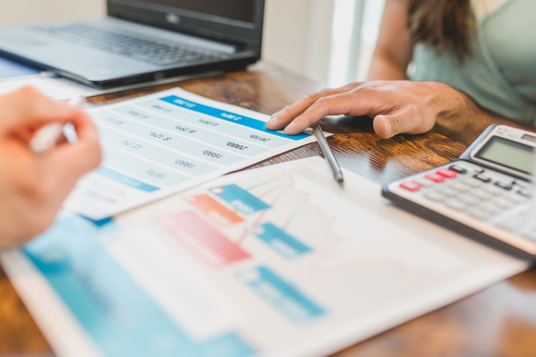 Business owner calculating how much revenue-based financing they can qualify for